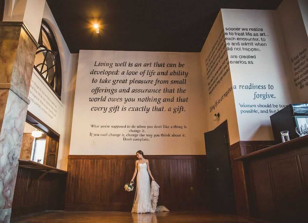 Bride posing in the Maya Angelou gallery of Millennium Event Center