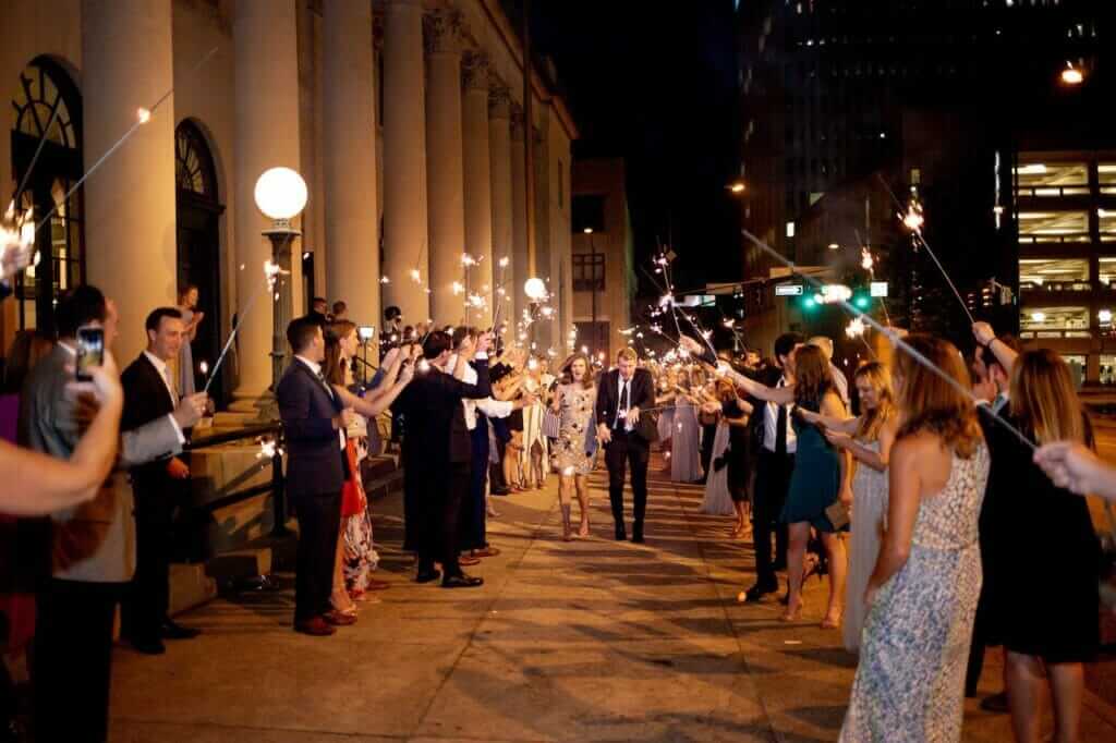 Newly wed couple running through a sparkler send off in Winston Salem, NC.