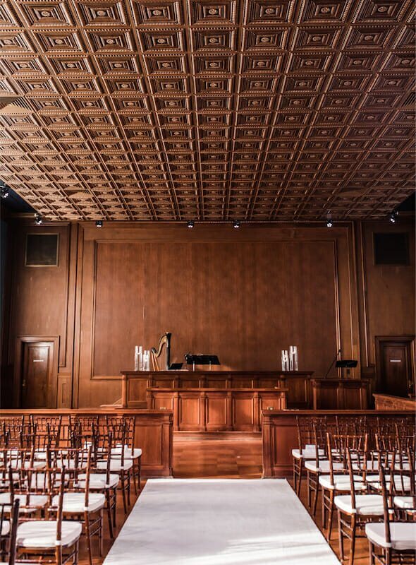 Explore the perfect Winston-Salem wedding venue for your special day, featuring a beautifully arranged ceremony set up in a large room.