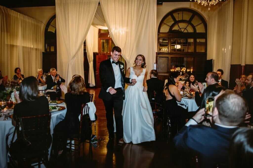 Bride and groom with wedding guests at Millennium E vent Center