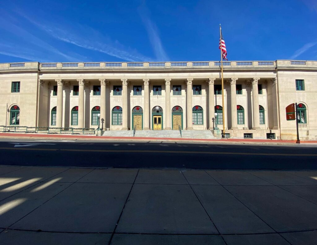 Exterior of Millennium Event Center in Winston-Salem featuring soaring columns.